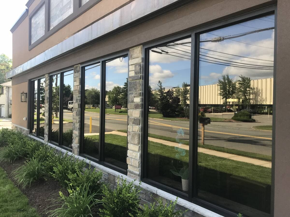 Aluminum-framed storefront windows on a New Jersey commercial building